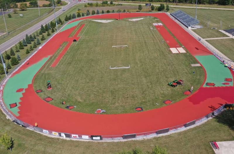 Crews with Track Surfaces Company in Elburn, resurface the La Salle-Peru Township High School Track on Tuesday, Sept. 23, 2025 at the La Salle-Peru Township High School Athletic Complex in La Salle. Crews have been resurfacing the track for the past week. LaSalle-Peru Township High School Sports Complex will be closed to the public for approximately four weeks while the track undergoes resurfacing work. The track was first installed in 2014.