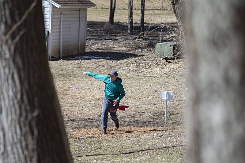Louie Ohlendorf of Amboy drives off the tee Sunday, March 13, 2022 during the St. Paddy’s Singles Disc Golf Tournament in Dixon.