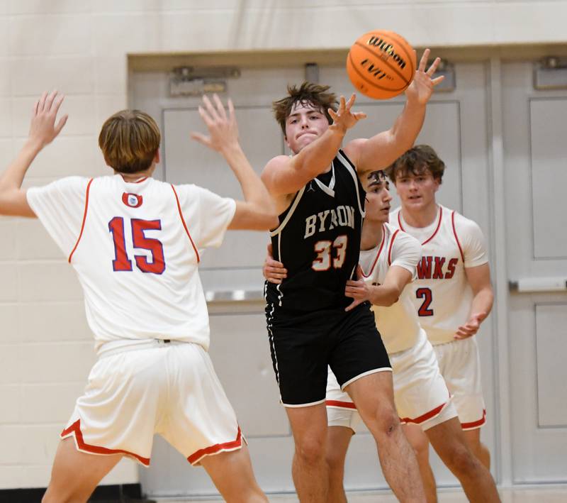 Byron's Caden Considine (33) draws the foul as he passes the ball out of an Oregon trap on Monday, Dec. 15, 2025 at the 64th Forreston Holiday Tournament at Forreston High School.