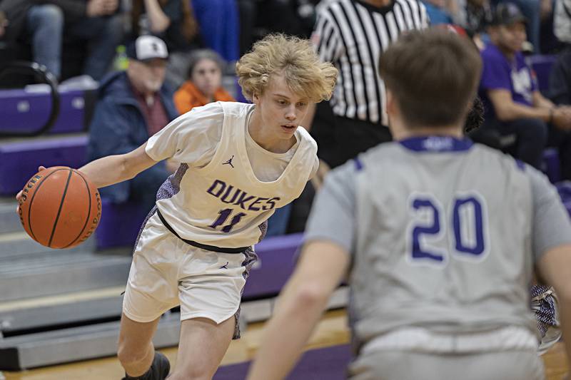 Dixon’s Jarrett McHugh drives to the hoop against Plano Wednesday, Dec. 6, 2023 at Dixon High School.