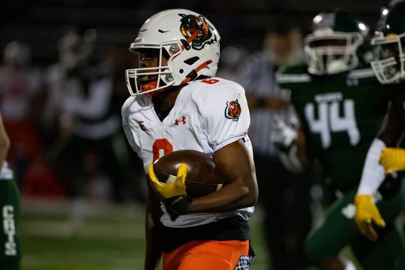 Plainfield East's David Croom runs the ball during a game against Plainfield Central Friday Sept. 27, 2024 at Plainfield Central High School