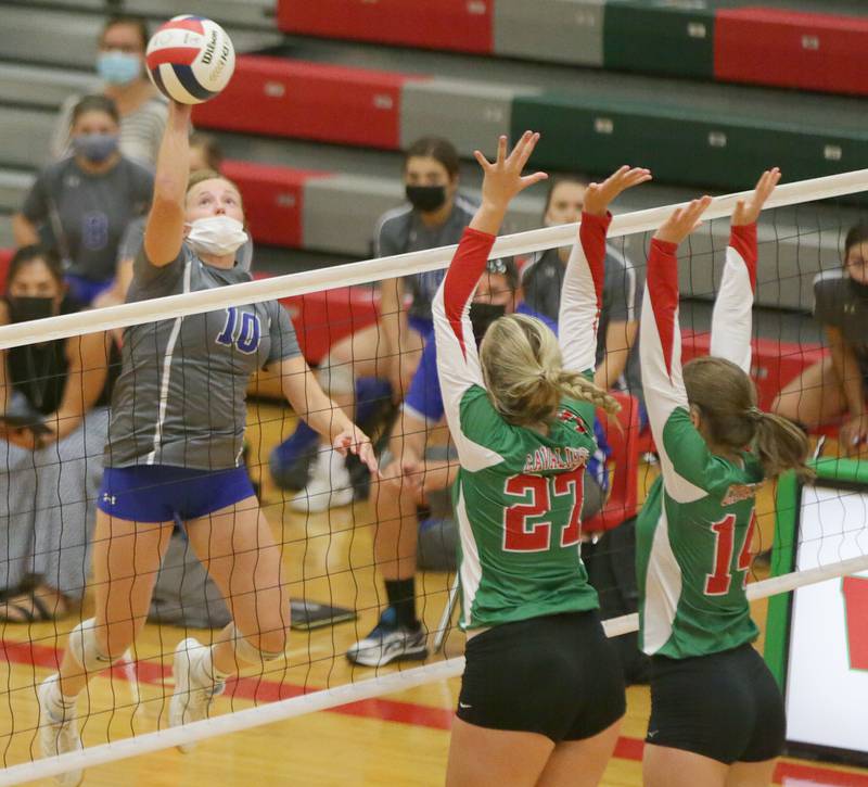 Princeton's Mckenzie Hecht (no,10) spikes the ball past L-P's Camryn Piscia, (no,27)) and teammate Isabella Lambert, (no,14) on Tuesday Aug. 24, 2021.