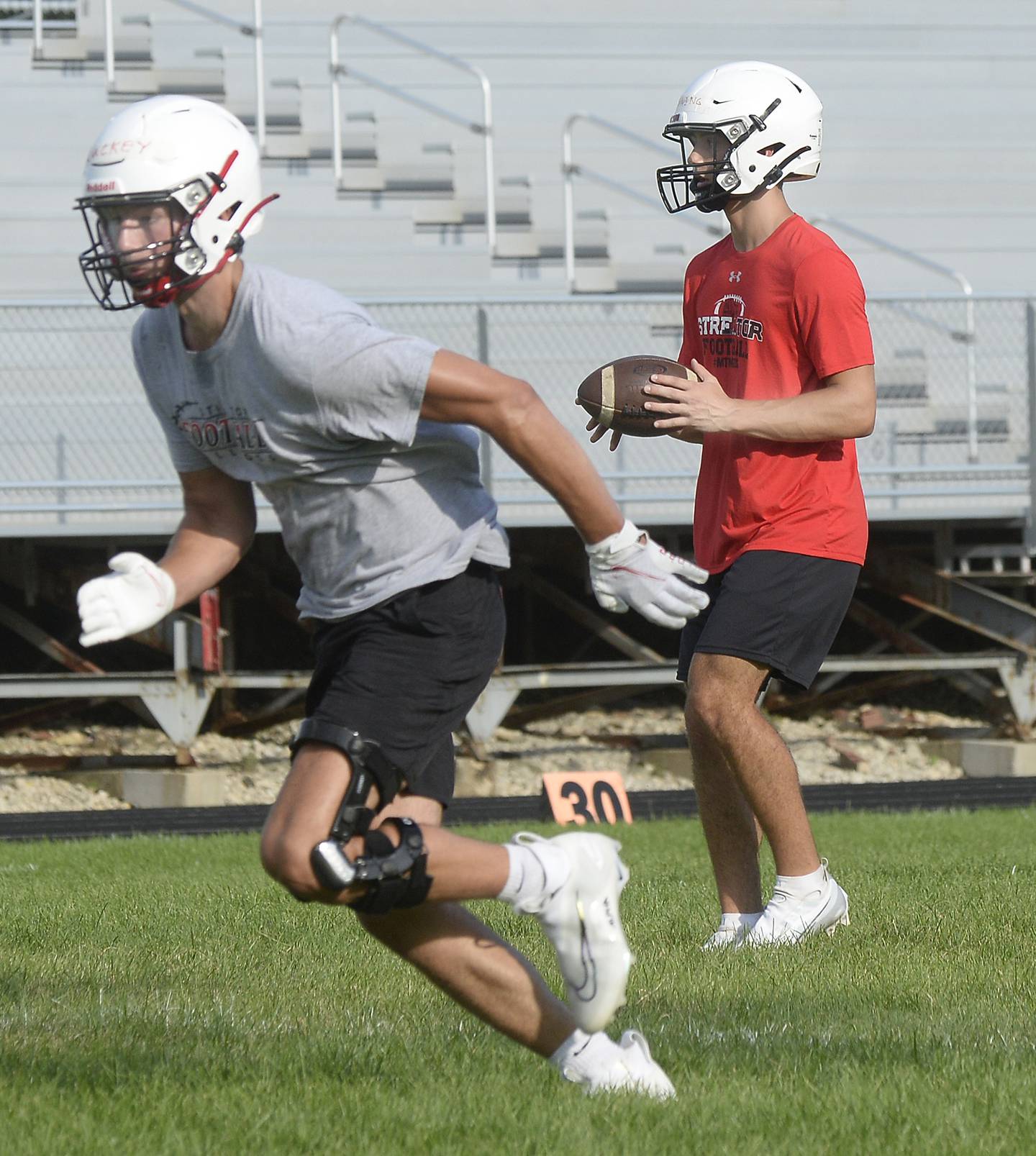 Streator quarterback Christian Benning starts a play during a 7-on-7 held Monday, July 11, 2022, at the SHS Athletic Fields.