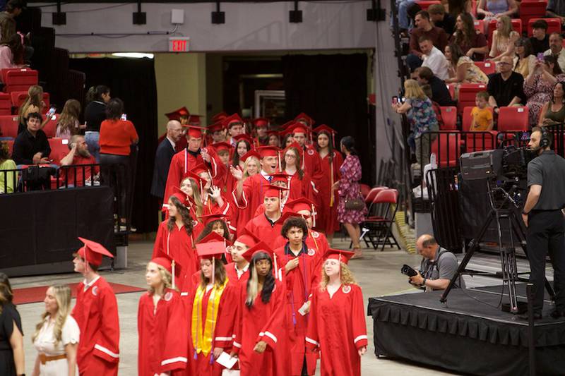 Yorkville High School Graduates enter the Commencement Ceremony at NIU Convocation Center on Friday, May 16, 2025 in DeKalb.