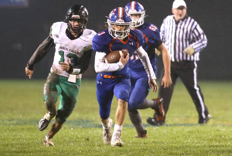 Genoa-Kingston's Austin Braffet carries the ball with Rock Falls' Richard Nichols in pursuit  during their game Friday, Oct. 13, 2023, at Genoa-Kingston High School.