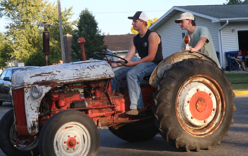 Putnam County High School students ride on a tractor during the inaugural Homecoming parade on Wednesday, Sept. 17, 2025 down Elm Street in Granville.