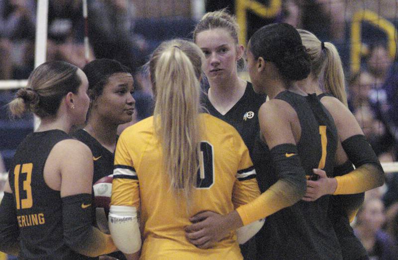 Sterling girls discuss strategy against Dixon. Sterling hosted Dixon in Volleyball on August 26, 2025 at Musgrove Fieldhouse.
