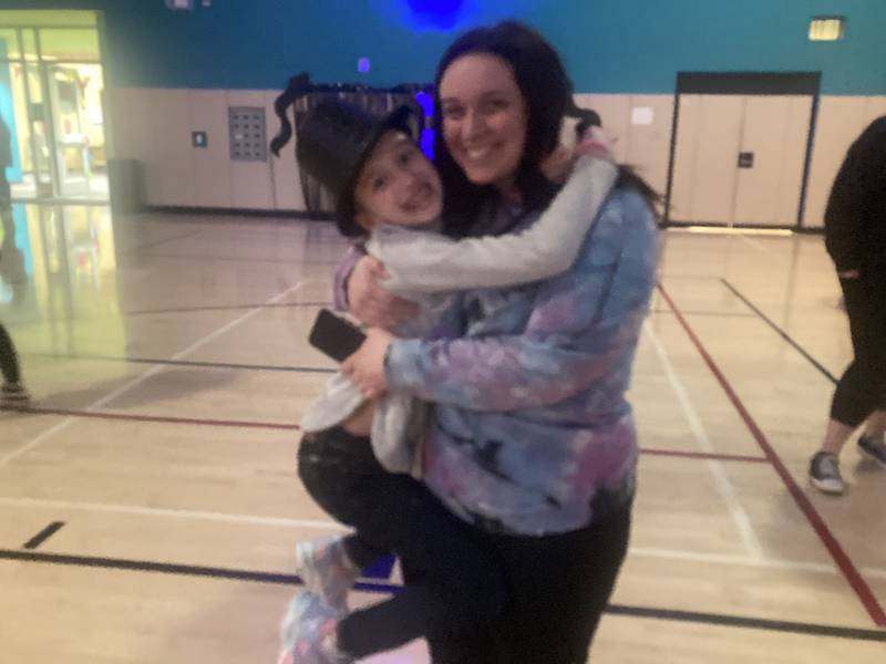 Raffle winner Katie Jones poses with her daughter Paypon Jones during the Nifty Swifty Night.
