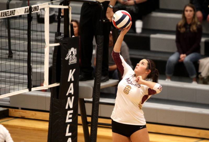 Emma Leavitt of Morris gets the ball over the net during a game at Kaneland on Thursday, Oct. 13, 2022.