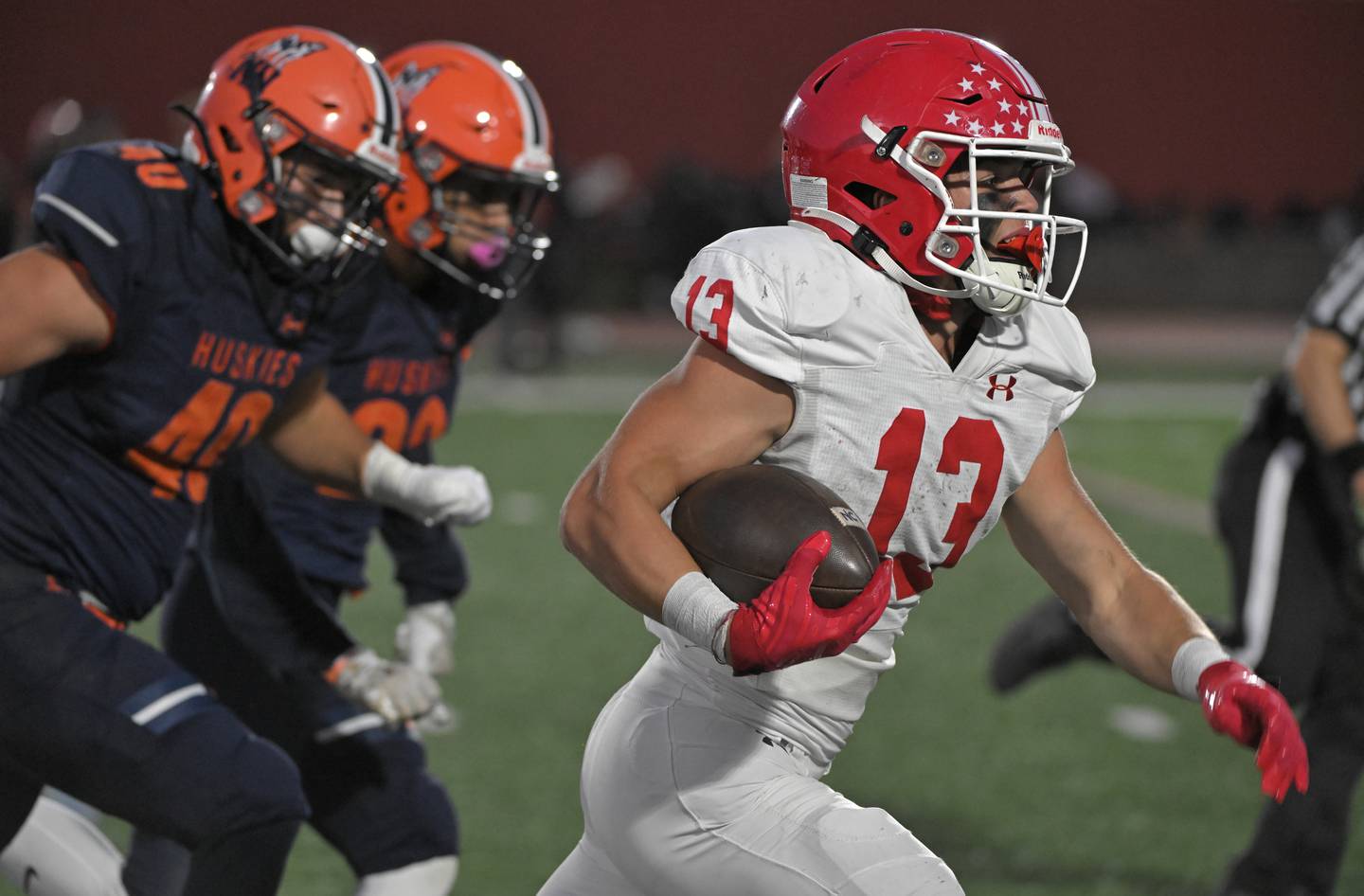 Naperville Central’s Aiden Clark runs for a long touchdown against Naperville North in a cross-town rivalry football game at North Central College in Naperville on Friday, Sept. 6, 2024.