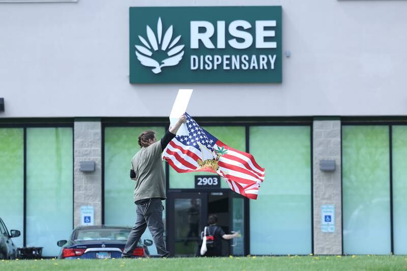 A union employee for Rise Dispensary outside the Rise Dispensary along Colorado Avenue in Joliet on Thursday, April 20, 2023.