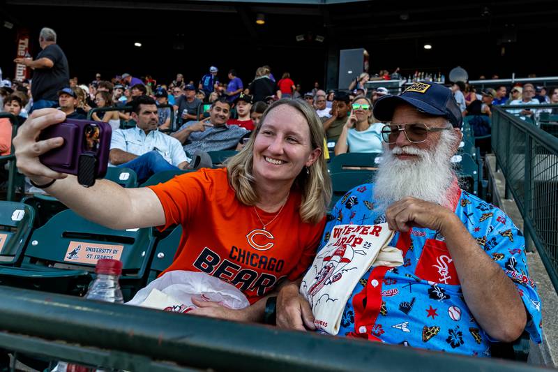 Amanda Jensen and Kimble Burich of Saint Francis University take a selfie during the Joliet Slammers game, which featured the Wiener Drop World Record Attempt, on July 22, 2025.