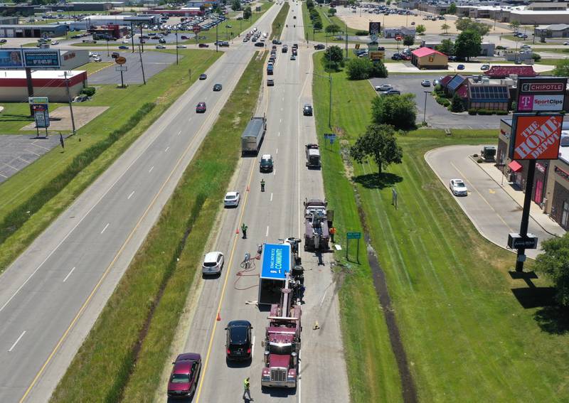Crews work the scene of a semi truck crash on Friday, June 14, 2024 near the intersection of 38th Street and Illinois 251 in Peru. A Goodwill semi truck overturned and extrication was needed. The crash happened shortly before 11:30a.m. Illinois Route 251 was down to one lane. Peru police believe injuries were not serious.