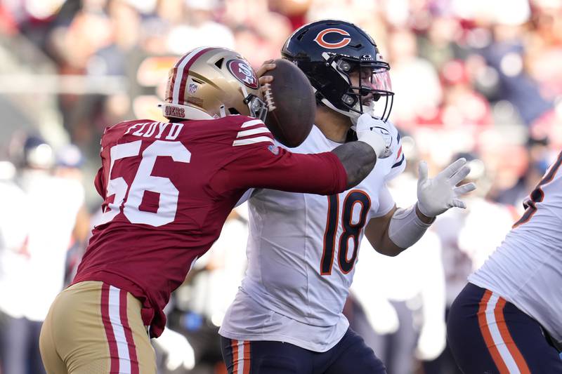 San Francisco 49ers defensive end Leonard Floyd (56) sacks Chicago Bears quarterback Caleb Williams (18) during the first half of an NFL football game in Santa Clara, Calif., Sunday, Dec. 8, 2024. (AP Photo/Godofredo A. Vásquez)
