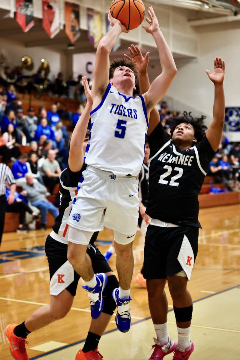 Princeton's Jack Oester shoots over Kewanee's Josh DeWante Tuesday night at Prouty Gym. The Boilermakers win 75-60.