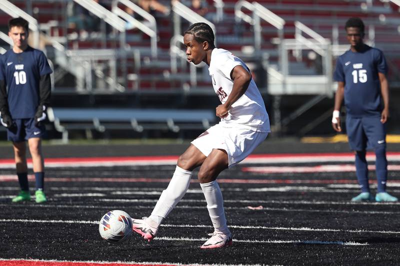 Bolingbrook’s Kamsiyochukwu Ifealjekwu scores on a penalty kick in the final seconds against West Aurora in the Class 3A Bolingbrook Regional championship match on Saturday, Oct. 26, 2024 in Bolingbrook.