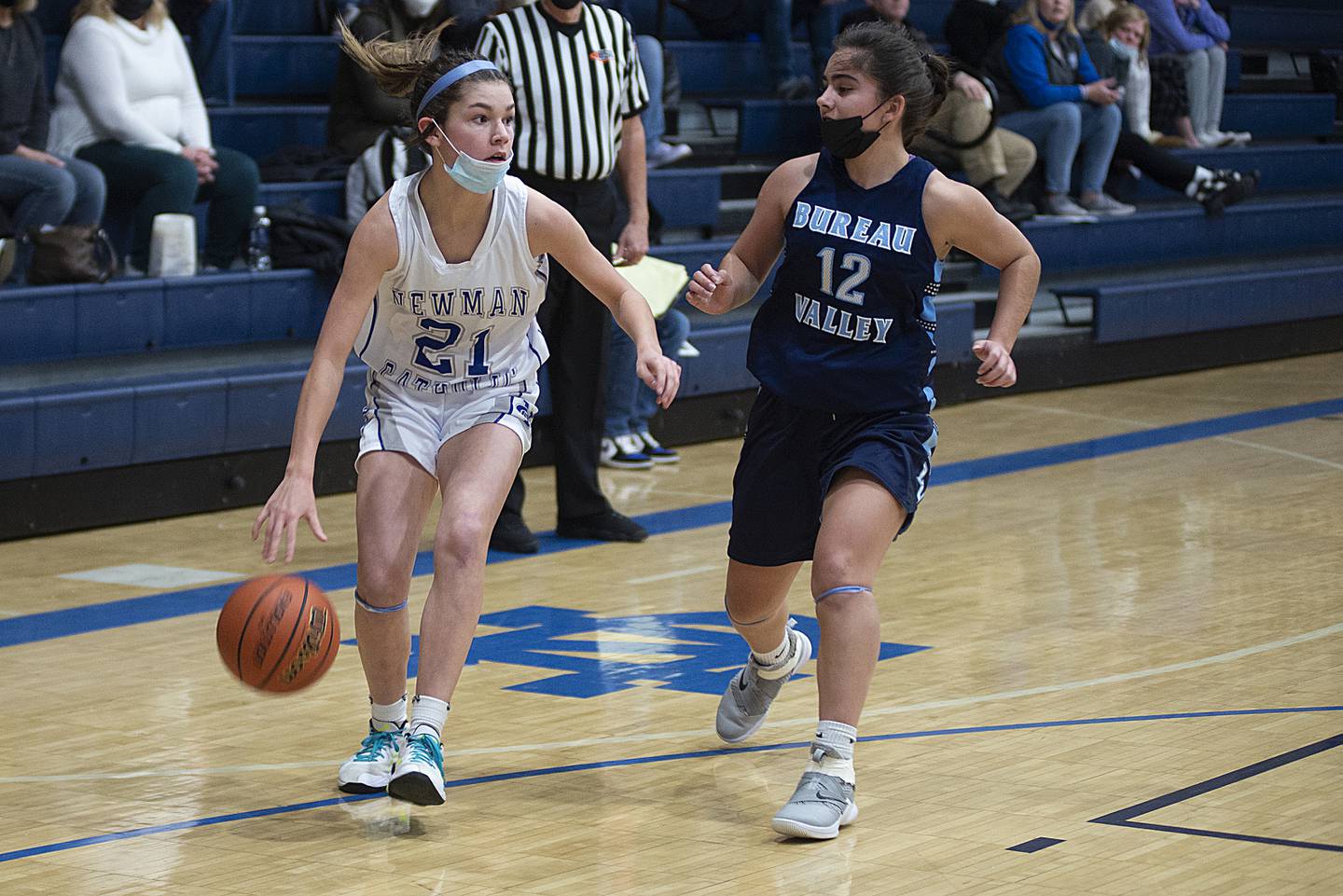 Newman's Madison Duhon handles the ball against Alexis Marquez Bureau Valley's Wednesday, Jan. 19, 2022.