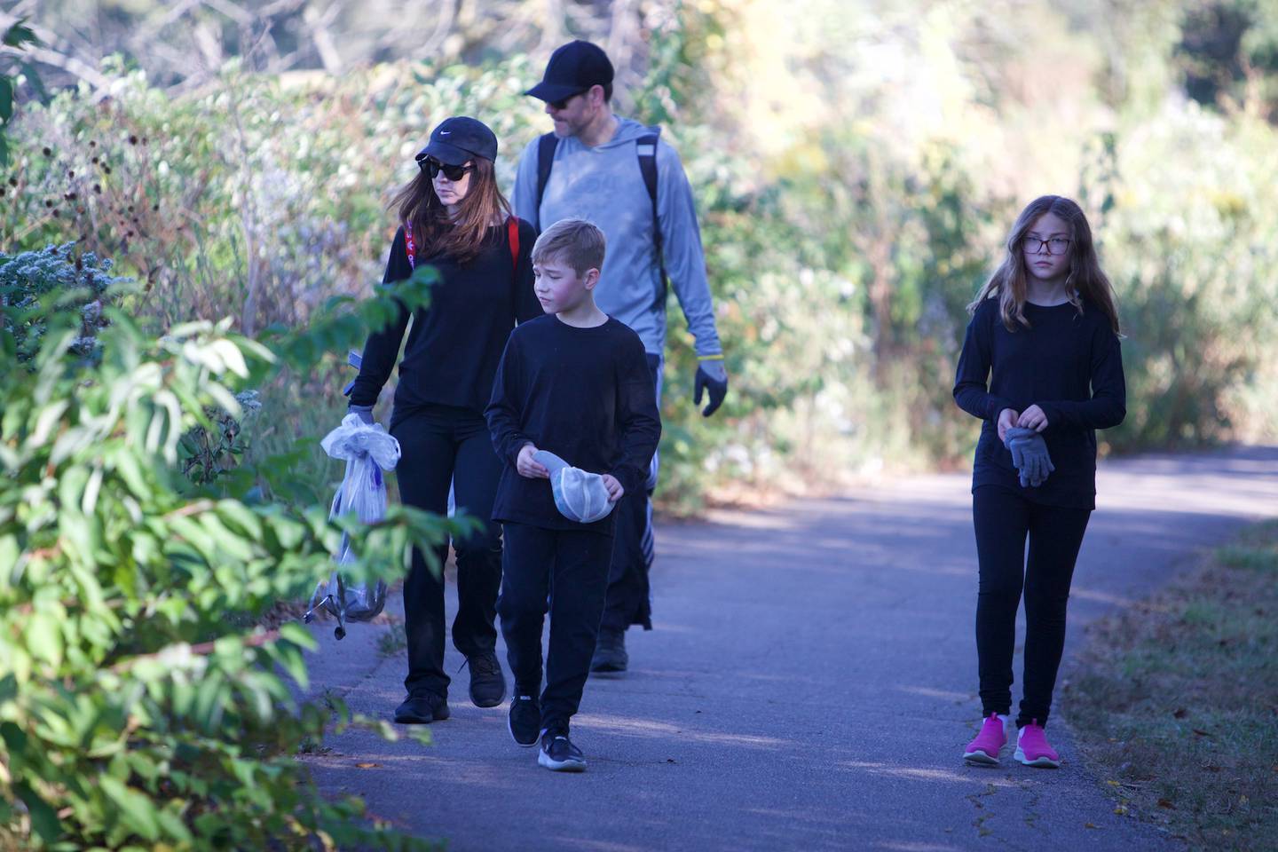 Volunteers take part in cleaning up along the Fox River on Saturday, Sept. 21,2024 in St. Charles.