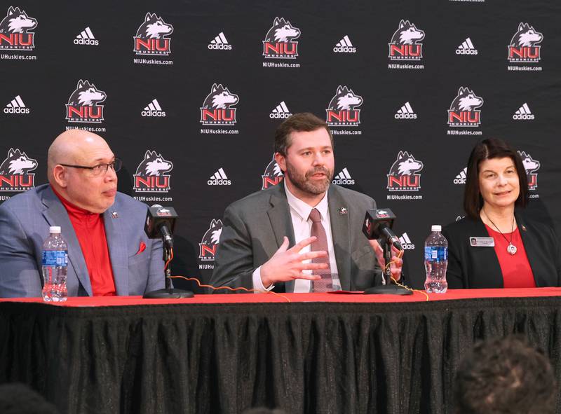 New Northern Illinois University men’s head basketball coach Matt Majkrzak answers questions while flanked by NIU Vice President/Director of Athletics and Recreation, Sean Frazier, (left) and university president Lisa Freeman Tuesday, March 24, 2026, during a press conference to introduce Majkrzak in the Convocation Center at NIU in DeKalb.