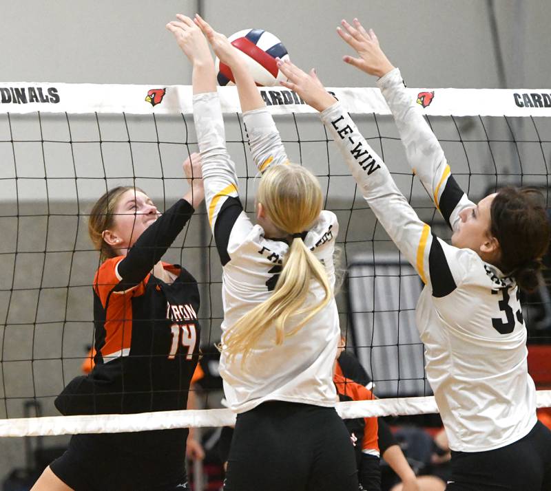 Byron's Hannah Gentz battles two Lena-Winslow players at the net during a match at the Stillman Valley Tournament on Saturday, Oct. 25, 2025 at Stillman Valley High School.