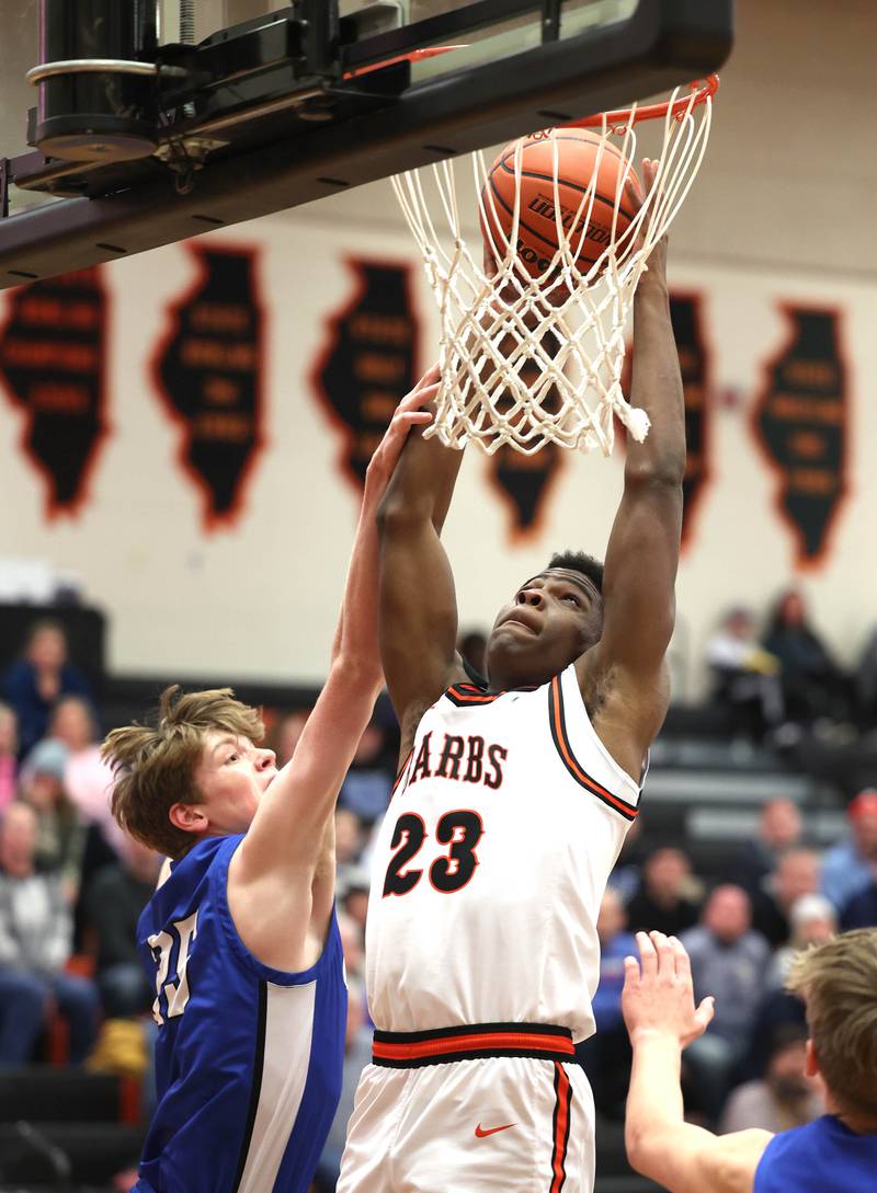 DeKalb’s Davon Grant is fouled by Geneva’s Hudson Kirby Thursday Dec. 28, 2023, during their second round game in the 96th Chuck Dayton Classic boys basketball tournament at DeKalb High School.