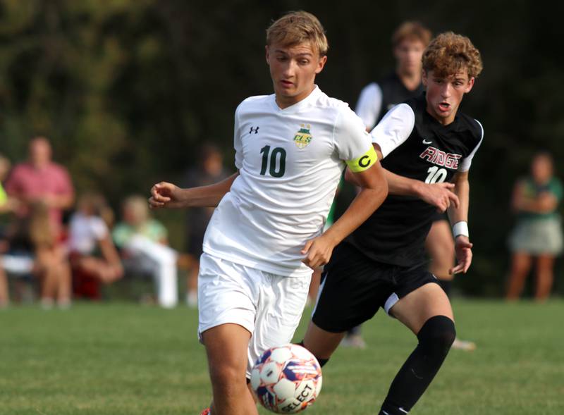 Crystal Lake South’s  Nick Prus battles Prairie Ridge’s Chase Santucci, right, in varsity soccer on Thursday, Sept. 19, 2024, at Prairie Ridge High School in Crystal Lake.
