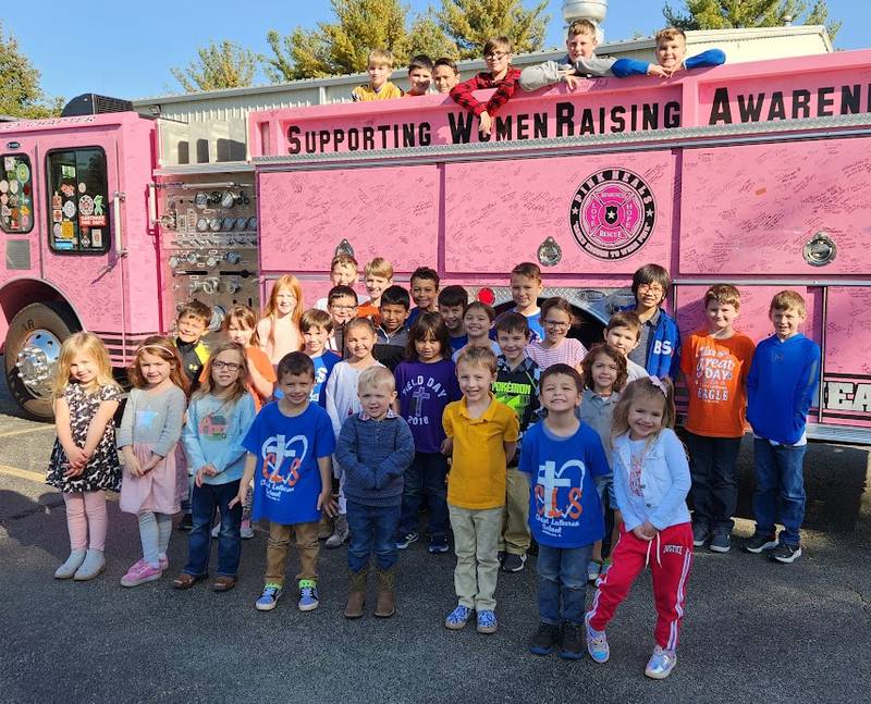 Pink Heals Sauk Valley chapter members visiting Sterling's Christ Lutheran School Friday, Oct. 21. Chapter members talked to students about how they visit people with cancer and bring them joy and hope. Pink Heals is a cancer goodwill group that provides support to those in need on a personal level through home visits.