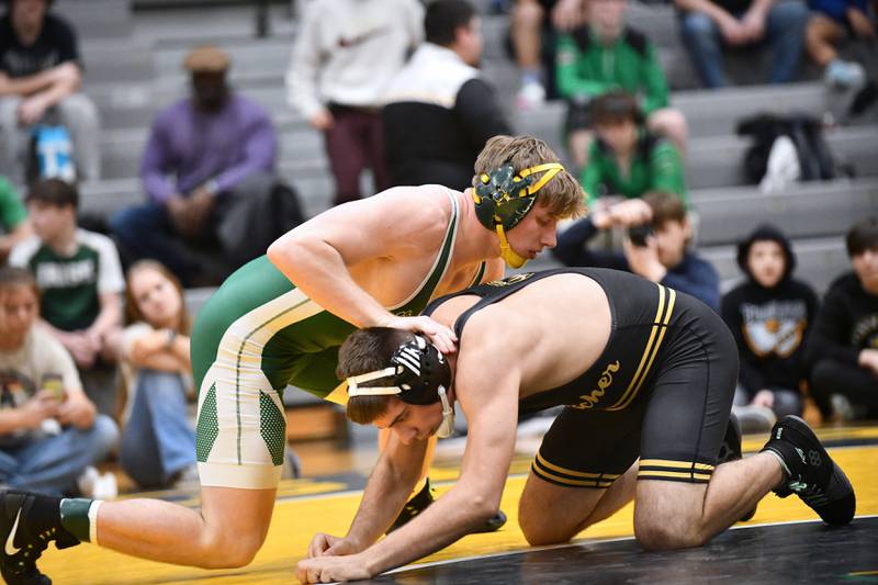 Coal City's Landin Benson wrestles Herscher's Braiden Linnabury during Benson's 165-pound match victory on Saturday, Feb. 8, 2025, in the IHSA Class 1A Herscher regional.