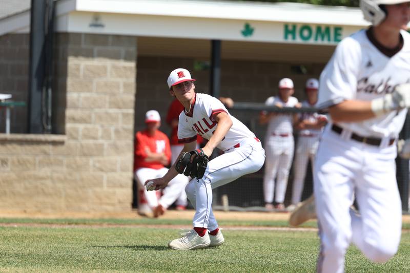 Spring Valley Hall’s looks to throw to first against Joliet Catholic in the Class 2A Geneseo Supersectional on Monday, May 29, 2023 in Geneseo.