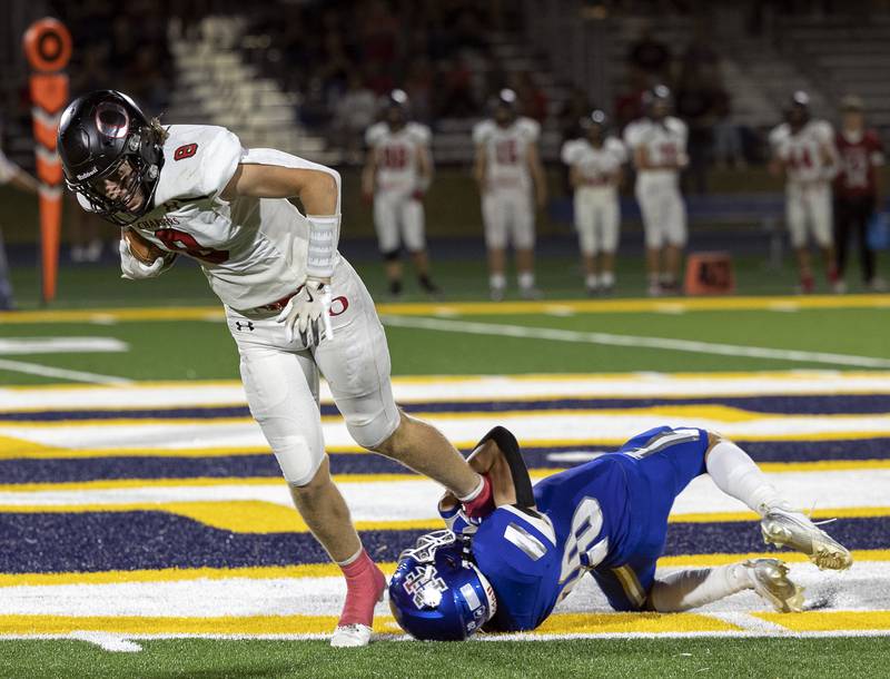 Newman’s Joseph Oswalt hangs onto the Orion’s Jake Bainbridge for a tackle Friday, Sept. 20, 2024, at Roscoe Eades Stadium in Sterling.