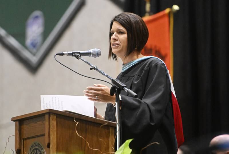 Wheaton Warrenville South High School principal Lorie Campos addresses the seniors during the graduation ceremony on Saturday, May 25, 2024 at the College of DuPage in Glen Ellyn.