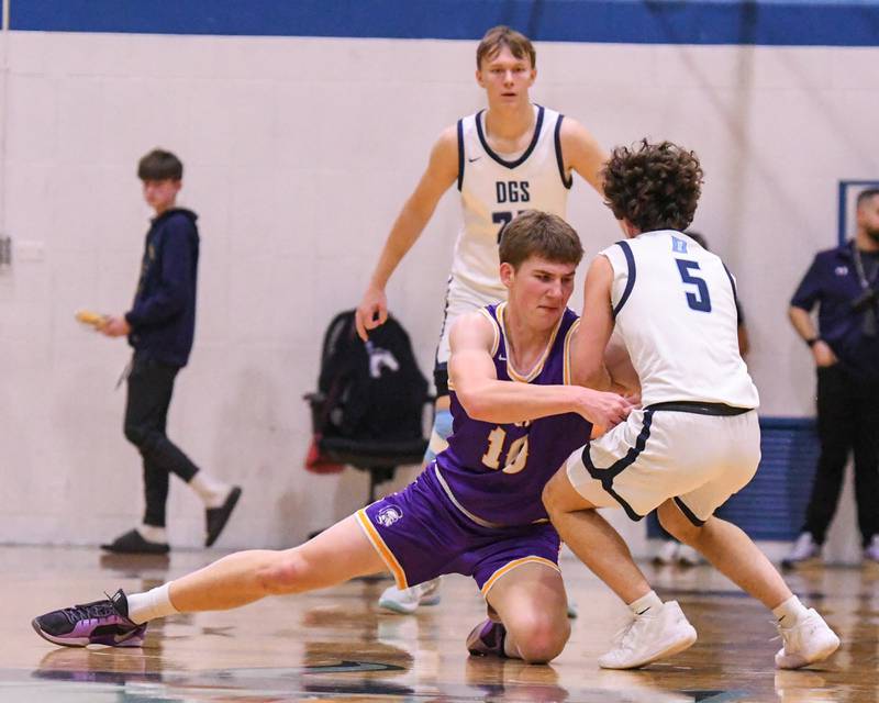 Downers Grove North's Bobby Grganto (10) and Downers Grove South's Wyatt Wawro (5) battle for the ball on Saturday Dec. 21, 20224, during the game on Saturday Dec. 21, 2024, held at Downers Grove South High School.