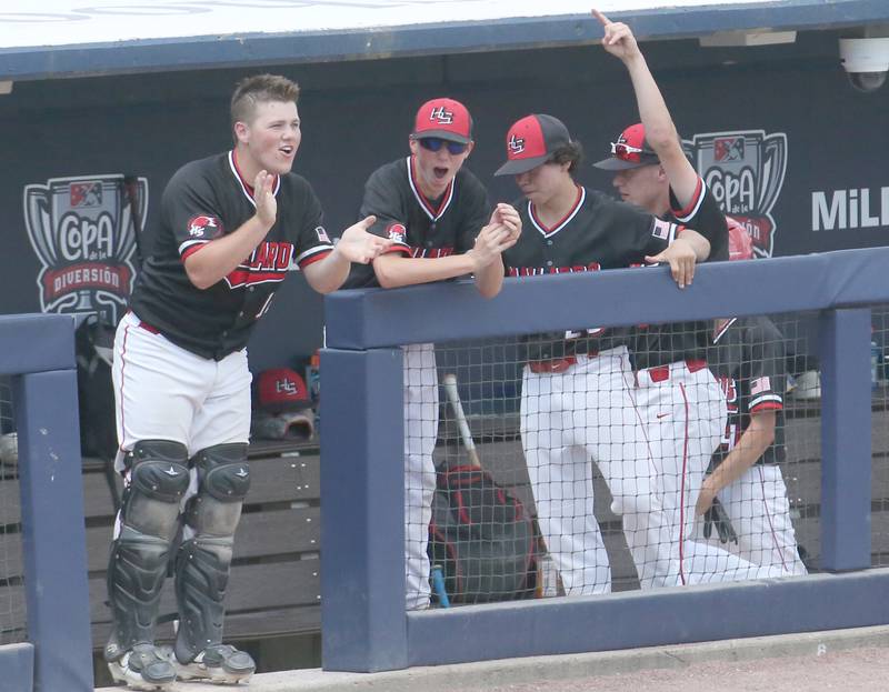 Henry-Senachwine players react while scoring a run against Newman during the Class 1A State semifinal game on Friday, June 2, 2023 at Dozer Park in Peoria.