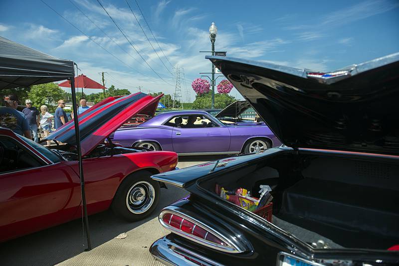 Another colorful machines makes its way on the Peoria Avenue bridge during the Petunia Fest car show Saturday, July 2, 2022. The bridge was lined with the color and chrome of these mobile works of art.