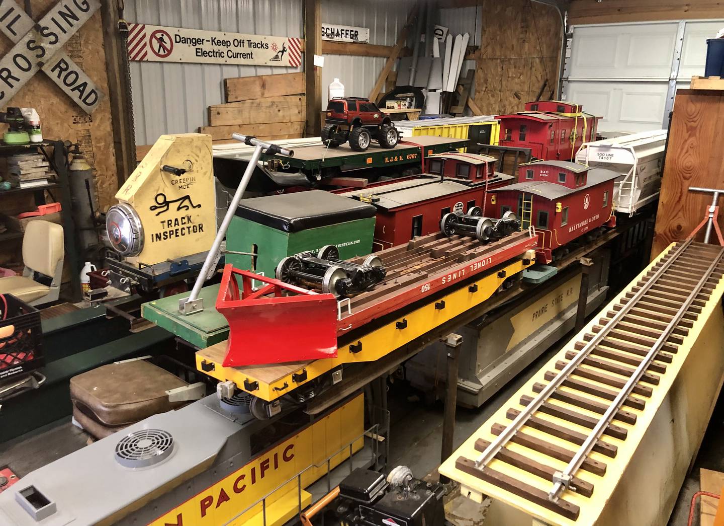 7.5 gauge trains in storage at the Prairie State Railroad Club hanger at Plowman's Park, similar to those that will be available for rides at the June 11 fundraising event.