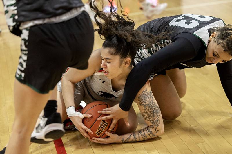 Sauk Valley’s Nakiya Rascon fights for a loose ball against Kishwaukee’s Cashay Stevenson Thursday, Jan. 12, 2023.