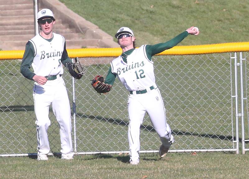 St. Bede's Seth Ferrari throws the ball back into the infield as teammate Ryan Slingsby assists on Wednesday, March 20, 2024 at St. Bede Academy.