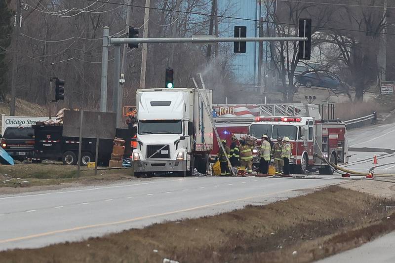 Fire crews work on putting out a semi trailer fire that shut down South Chicago Street between Old Elm Road and West Laraway Road on Thursday, March 16th, 2023 in Joliet.