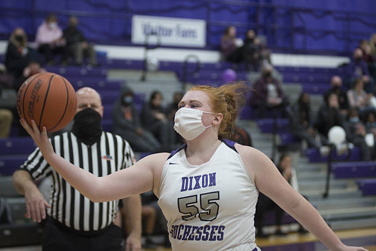 Dixon’s Mackenzie Welch works to save a ball from going out of bounds against DeKalb on Monday, Jan. 24, 2022.