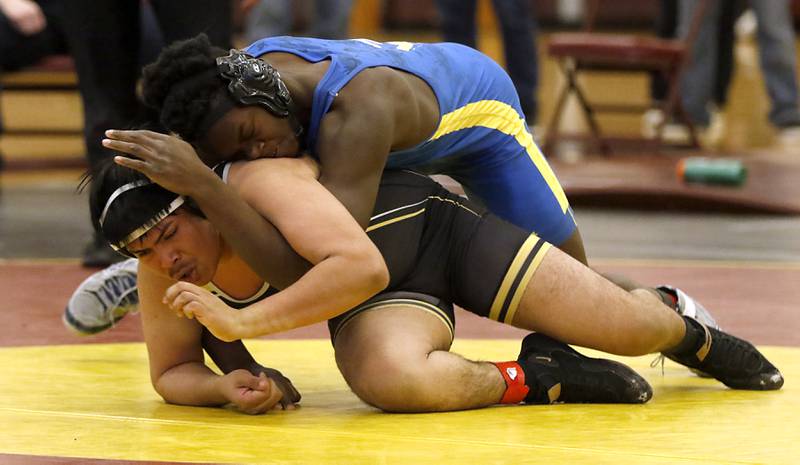 Johnsburg’s CJ Ameachi controls Harvard’s Edgar Hernandez in their 195-pound championship wrestling match in the IHSA 1A Richmond-Burton Wrestling Regional Thursday, Jan. 19, 2023, at Richmond-Burton High School in Richmond.