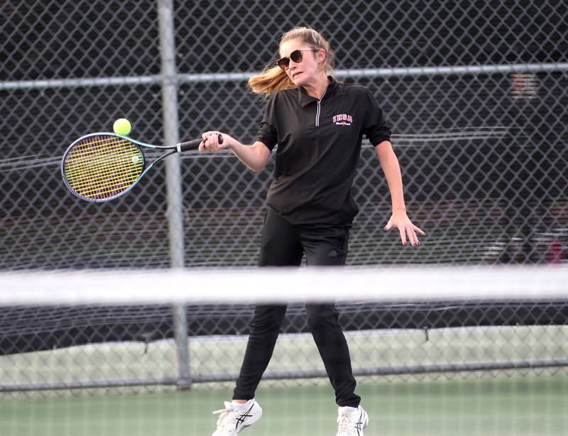 LaSalle-Peru’s Carlie Miller returns the ball during the first day of the IHSA state tennis tournament at Rolling Meadows High School on Thursday, Oct. 20, 2022.