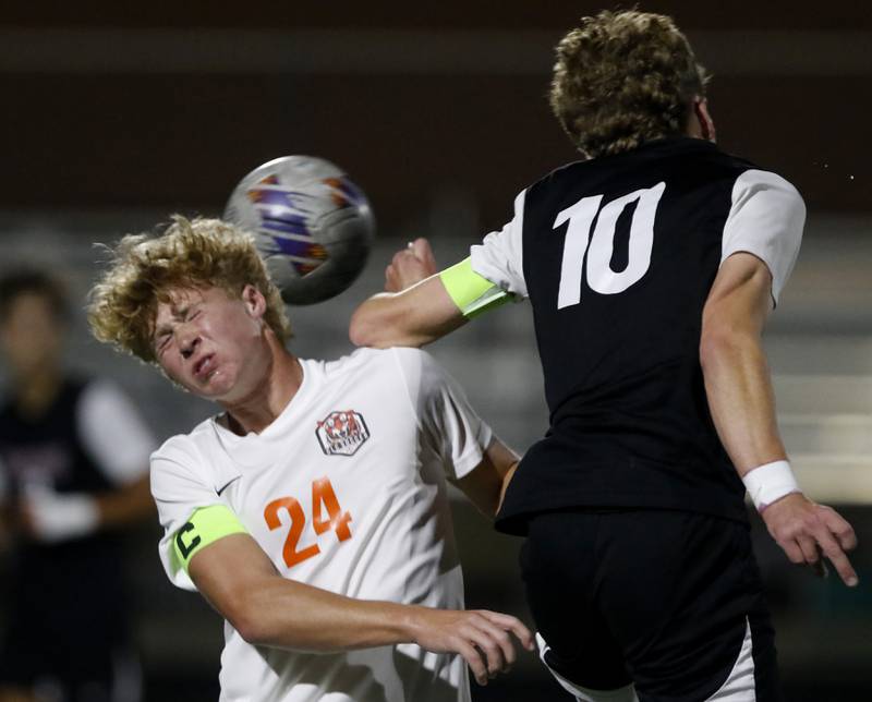 Crystal Lake Central’s Gavin Kane heads th ball away from Prairie Ridge's Chase Santucci during the IHSA Boys Soccer 2A Grayslake Central Sectional semifinal match on Tuesday, Oct. 29, 2024, at Grayslake Central High School,
