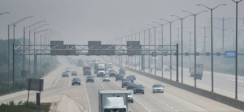Drivers travel in hazy conditions Wednesday along I-90. Poor air quality continues due to smoke from Canadian wildfires.