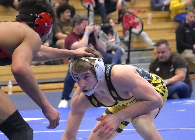 Joliet West's Carson Weber looks for an opening in the 144-pound final against Pekin's RaMez Watson at the Class 3A Quincy Sectional on Saturday.