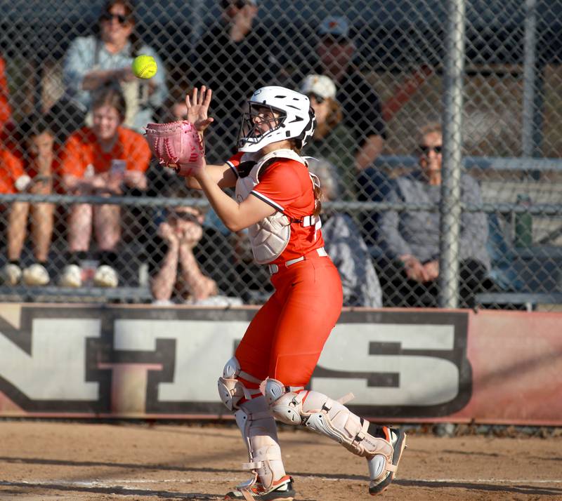 St. Charles East's Hayden Sujack catches a foul ball during a game against Downers Grove North on Friday, March 28, 2025 in St. Charles.
