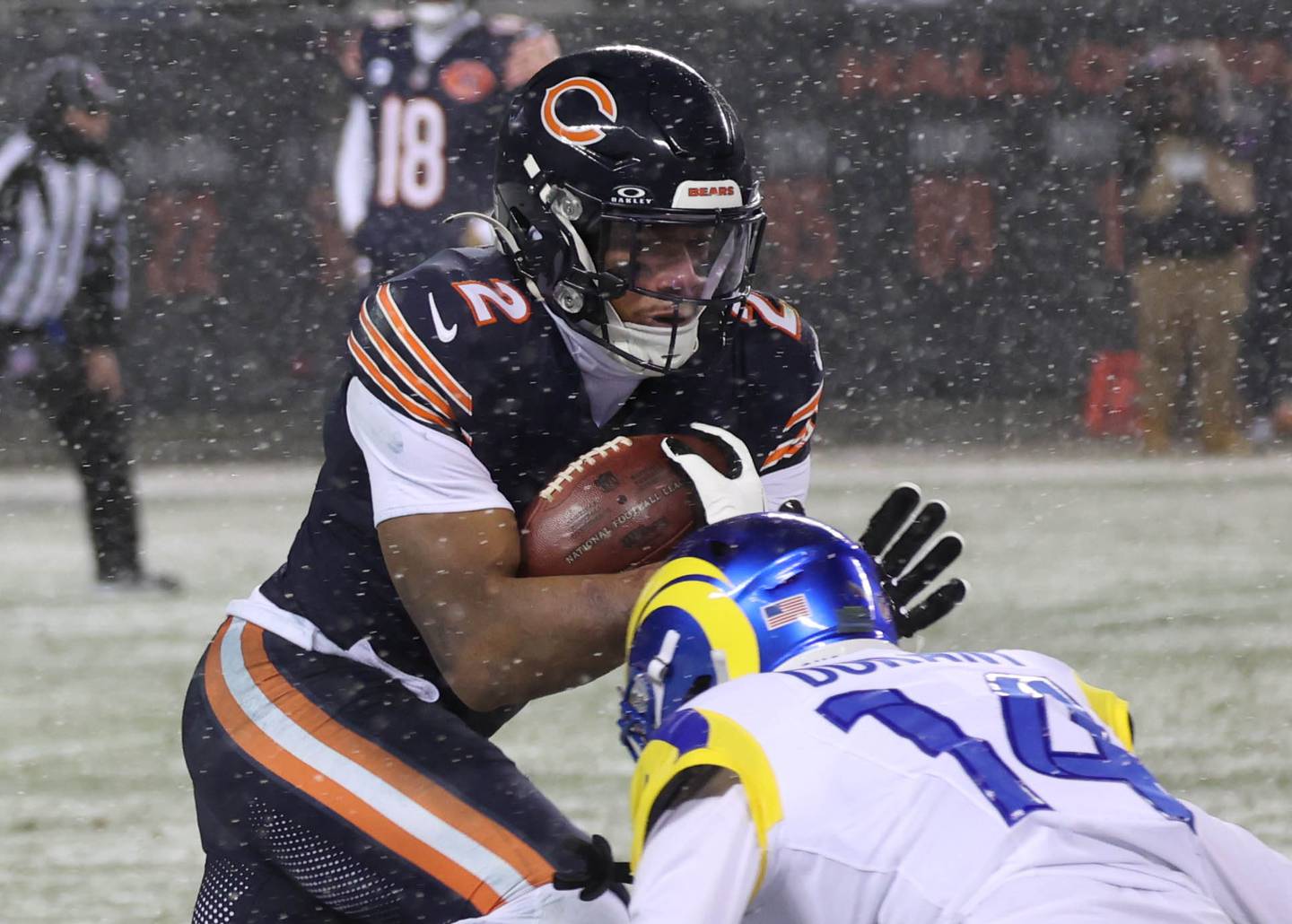 Chicago Bears wide receiver DJ Moore looks to get by Los Angeles Rams cornerback Cobie Durant Sunday, Jan. 18, 2026, during their NFC divisional playoff matchup at Soldier Field in Chicago.
