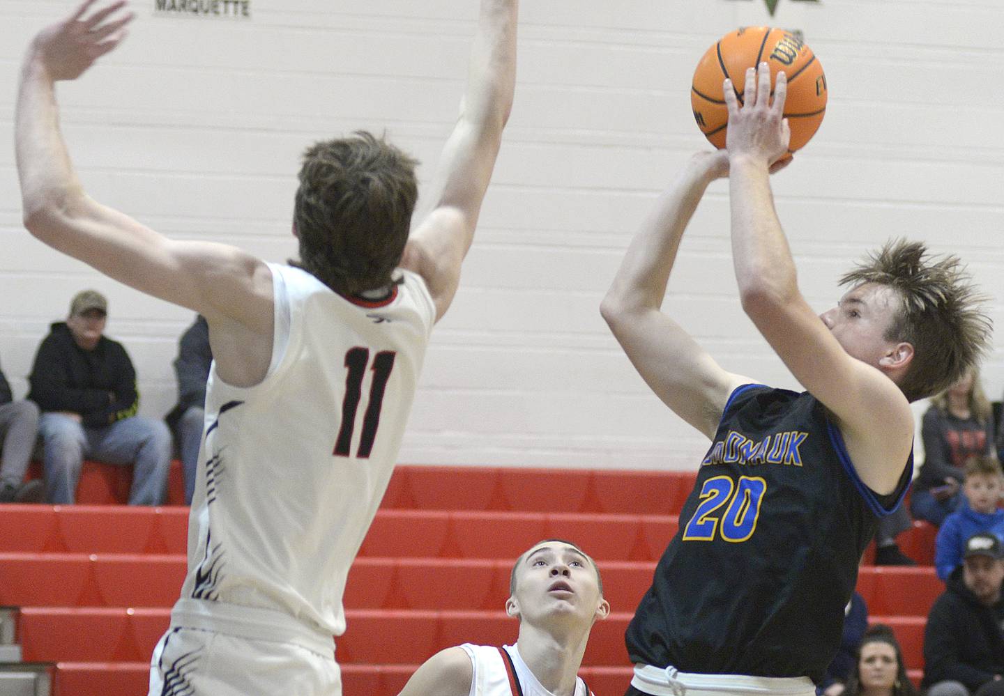 Somonauk’s Luke Hartsell shoots over the block attempt by Woodland’s Nate Berry in the 2nd period Wednesday at Woodland.