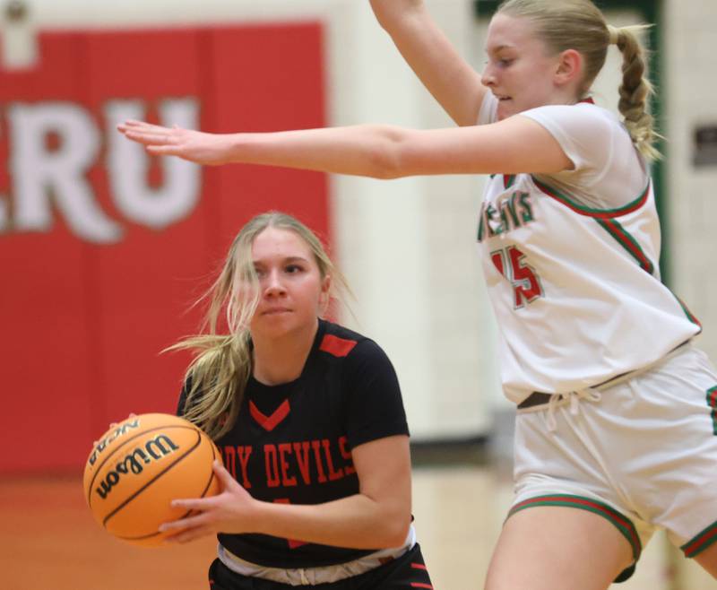 Hall's Charlie Pellegrini fakes a pass against L-P's Margaret Boudreau on Monday, Jan. 12, 2026 in Sellett Gymnasium at L-P High School.