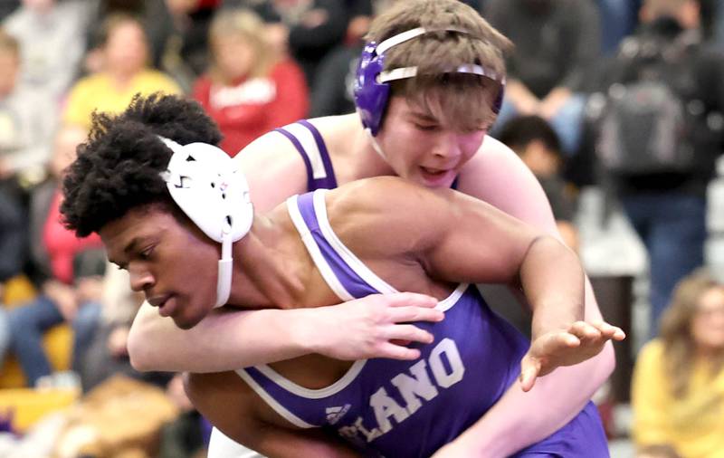 Plano’s Richie Amakiri and Rochelle’s Brock Metzger wrestle in their 182 pound championship match Saturday Jan. 21, 2023, during the Interstate 8 Conference wrestling tournament at Sycamore High School.