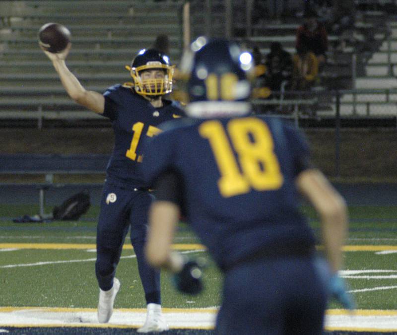 SHS Quarterback Brady Berlin throws a pass to James Miller..  The Galesburg Silver Streaks traveled to Sterling to take on the Warriors at Prescott Memorial Field at Roscoe Eades Stadium, September 26, 2025.